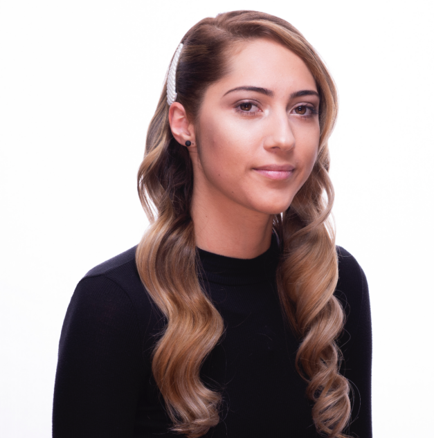 Woman with cool brunette balayage highlights with curled texture